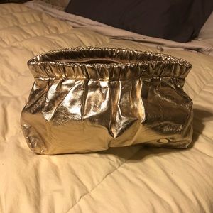 Donna Karan Gold metallic clutch or cosmetic bag